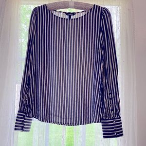 Blue/whit/gold stripes with classic button down sleeves. Size XS